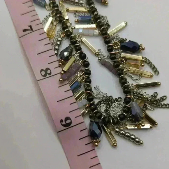 Premier Jewelry necklace with dark beads and gold, purple and white dangles. - Picture 4 of 4